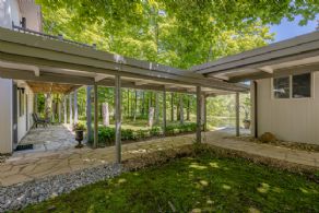 Covered stone walkway joining the guest house & main house - Country homes for sale and luxury real estate including horse farms and property in the Caledon and King City areas near Toronto