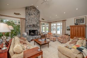 Great room with fieldstone fireplace and walk-out to stone terrace - Country homes for sale and luxury real estate including horse farms and property in the Caledon and King City areas near Toronto